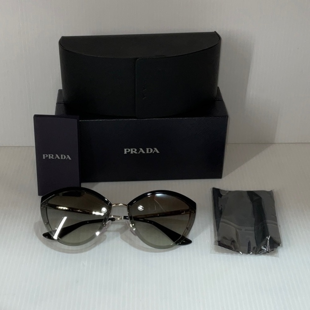 Prada woman’s sunglasses spr 07U cat eye green lenses made in Italy